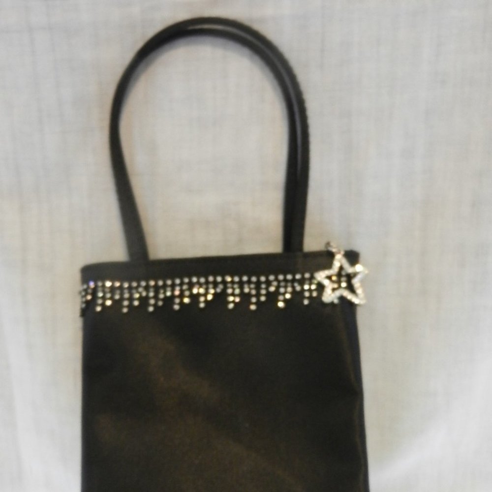 Nine West 5 x 7 clutch purse with crystals on outside and a Crystal Star